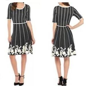 NWT Gabby Skye Knit Gray & White dress with flows at the bottom hem size large